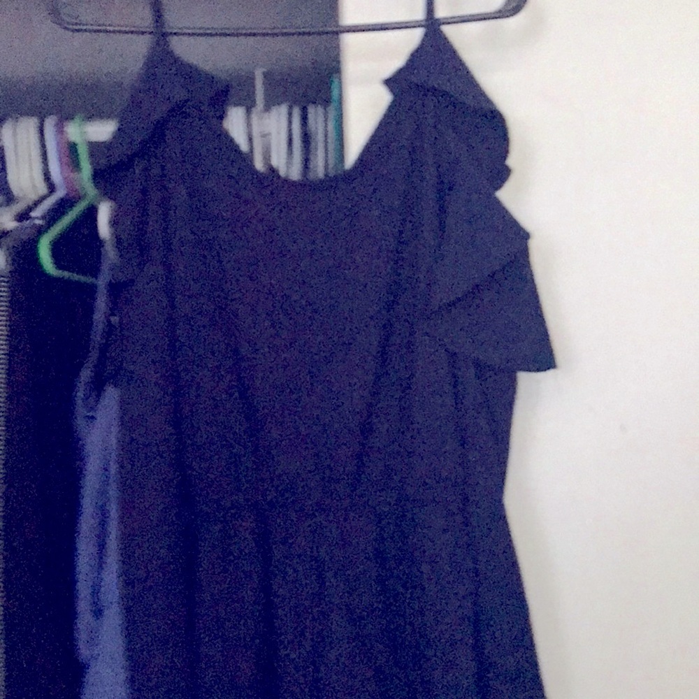 Navy blue jumper never worn. Long sleeve with shoulder open.